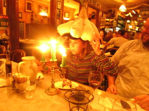 Zoe in giant garlic hat