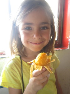 Lanie enjoys a mango before we embark.