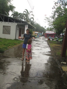 Jen and Lanie venture into Main Street to feel the rain.