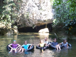 Tubing into the cave with our friend Sarah