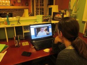 Grandma gets a pre-trip lesson on Skyping.